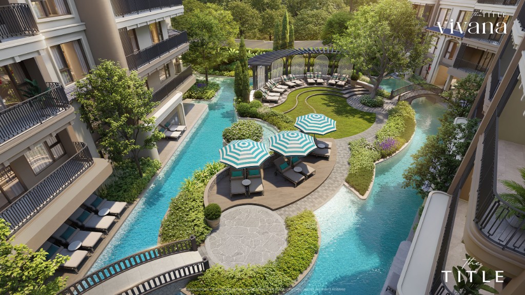 The Title Vivana Kamala — lagoon pool deck with curved sun loungers and pergolas inside the infrastructure hub